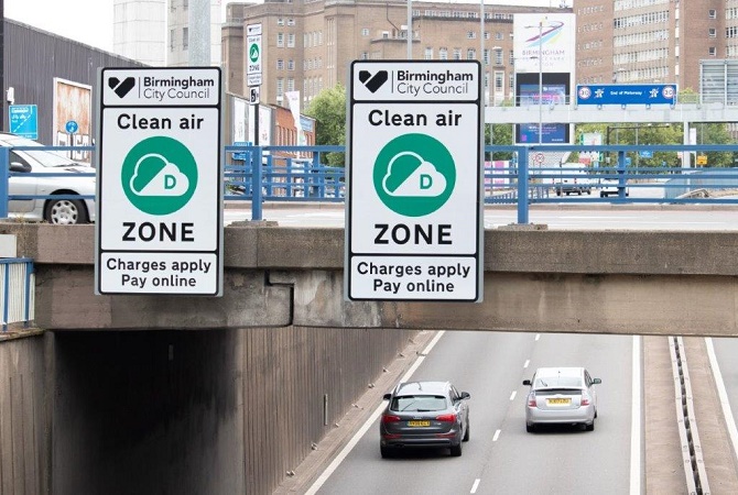 Signage over bridge showing entry to zone